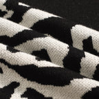 Pull vintage en jacquard rose et noir à col V pour homme