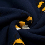 Pull vintage à manches courtes en tricot bleu marine avec motif abeille