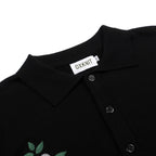Cardigan noir pour homme en maille avec broderie florale et bords rayés