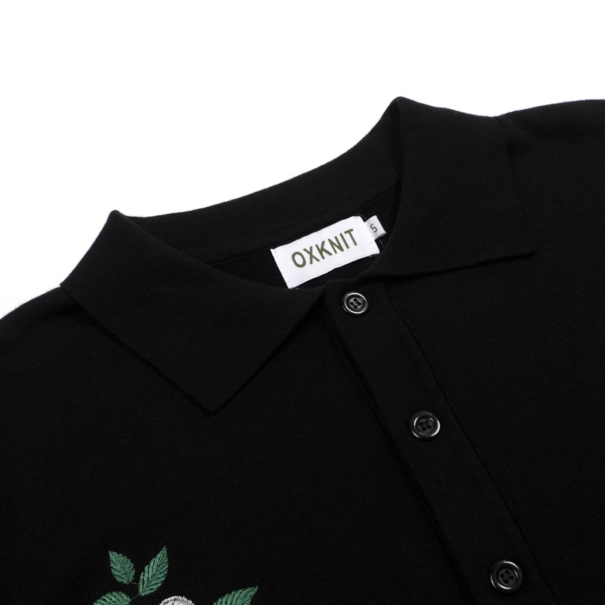 Cardigan noir pour homme en maille avec broderie florale et bords rayés