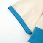 T-shirt tricoté à rayures crème, rouge et bleu 70s – Style rétro sportif