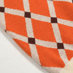 Pull en tricot à losanges orange pour homme, style universitaire des années 70