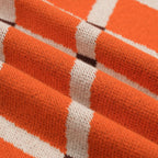 Pull en tricot à losanges orange pour homme, style universitaire des années 70