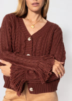 Cardigan en tricot torsadé avec bordure à franges - rouge rouille